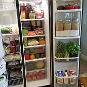 Open fridge with organized containers of food